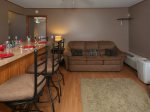 Great separate Guest House set up for kids or third couple with sofa sleeper, bean bags and a high top bar.